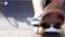Blurred legs of skateboarder