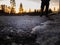 Blurred lonely man standing on road watching sunrise, selective focus