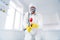 Blurred low angle view photo of sprayer cleaner hold latex gloves goggles coverall spray sanitize surface stop spreading