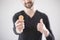 Blurred man in a black T-shirt holding a bitcoin and a thumb up