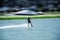 Blurred- Men athletes are playing Wakeboarding for X-Stream sports with daylight in beautiful blue lake,concept relaxing and
