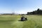 Blurred motion of female golf player on a golf course