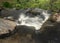 Blurred motion stream falls from top of waterfall of Pistyll Rhaeadr