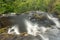 Blurred motion stream falls from top of waterfall of Pistyll Rhaeadr