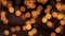 Blurred orange Christmas bokeh illumination waving. Abstract particles background