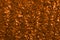 Blurred orange  glittery bright shimmering background perfect as a  backdrop. Wonderful workpiece for the designer.Christmas backg