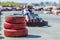 Blurred out of focus athlete on a kart racing on the track