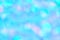 Blurred pastel neon blue mint pink holographic bokeh background texture