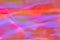 Blurred pastel neon pink, purple, blue, orange holographic foil background