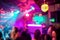 Blurred people inside disco club with colorful laser lights in background - Defocused image - Concept of nightlife with music