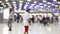 Blurred people moving in airport.