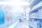 Blurred pharmacy drugstore interior with rows and shelves with medications remedies. Medical background