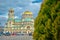 Blurred photo of Alexander Nevsky Cathedral with clear photo of green and yellow