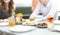 Blurred photo of woman and man waiting for their friends to arrive in restaurant