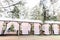 Blurred photo of wooden tent restaurant with wooden tables and chairs., decorated with light bulbs Vintage design of the