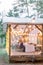 Blurred photo of wooden tent restaurant with wooden tables and chairs., decorated with light bulbs Vintage design of the