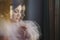 Blurred picture of charming tender bride in pink dress