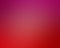 Blurred pink and red background in sunrise or sunset colors with smooth texture in elegant vibrant