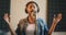 Blurred portrait of african american female singer recording song at sound record studio