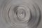 Blurred radial motion gradient dark gray background. Circular brushed texture