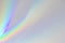 Blurred rainbow light refraction texture on white wall