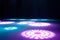 blurred rays of light on disco floor. pink blue neon searchlight lights. laser lines and lighting effect