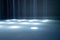 blurred rays of light on disco floor. white blue neon searchlight lights. laser lines and lighting effect