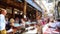 Blurred restaurant with people eating food and having conversation in an outdoor restaurant. Defocused