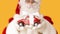 Blurred Santa Claus suggesting toy car Volkswagen Beetle with present bow