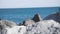 Blurred seascape background. Footage. Camera view of the rocky beach of the Black sea.