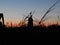 Blurred shot of a silhouette of a windmill with beautiful scenery of sunset