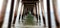 Blurred shot of the underneath of a wooden pier on the beach