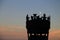 Blurred silhouette of crown shape torch on evening sky with the moon, Abstract image of Scottish symbol from Edinburgh castle,