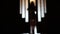 Blurred silhouette of a girl in the room in doorway