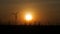 Blurred silhouette wind turbine and grass field with twilight