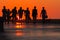 Blurred silhouettes group of teenagers on the dock