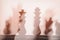 Blurred silhouettes of main chess pieces, king and queen, abstract background