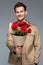 blurred smiling man holding bouquet of