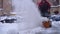 Blurred Snow blower in action clearing a residential driveway after snow storm