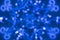 Blurred snowflake on a blue background.