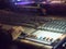 Blurred sound engineer console in concert indoor