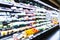 Blurred supermarket aisle shelves chilled fruit and vegetable zone