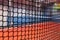 Blurred tennis playground behind the net at indoor activity park