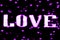 Blurred text purple LOVE sign LED Bokeh neon light purple on background bokeh lights heart soft colorful
