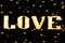 Blurred text yellow gold LOVE sign LED Bokeh neon light yellow gold on background bokeh lights heart soft colorful