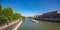 Blurred tourist boat over Seine river and road in Paris