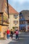 Blurred tourists exploring the Picturesque street in Ribeauville