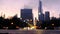 Blurred traffic in the city at night. Cars moving thru an intersection with Chicago buildings in the background