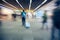 Blurred unidentified many people traveler at airport terminal for background