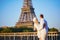 Blurred unrecognizable couple near the Eiffel tower